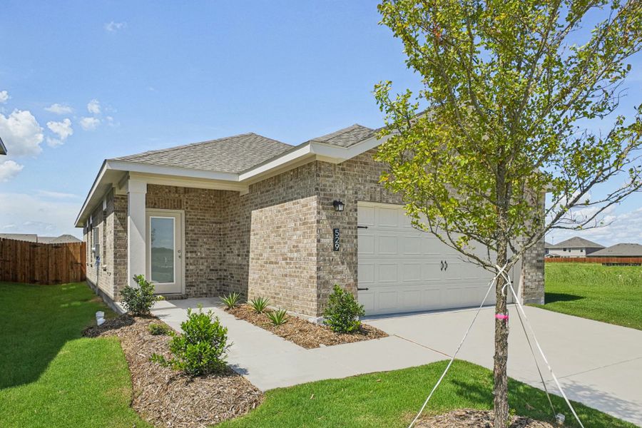 Representative exterior photo of a completed home built from the Odyssey by Starlight Homes in Coyote Meadows, Anna, TX (Image 19).