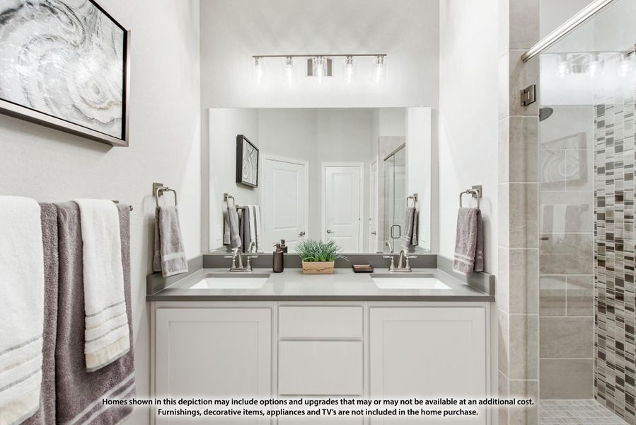 Bathroom with double sink vanity, white cabinets, large mirror, and tiled walk-in shower Bathroom with double sink vanity, white cabinets, large mirror, and tiled walk-in shower