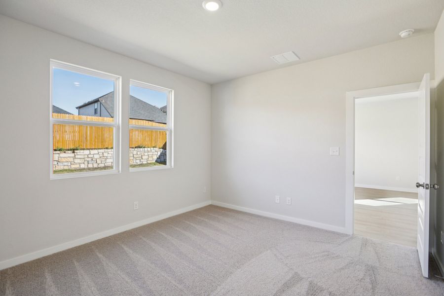 A room with a window and a door.