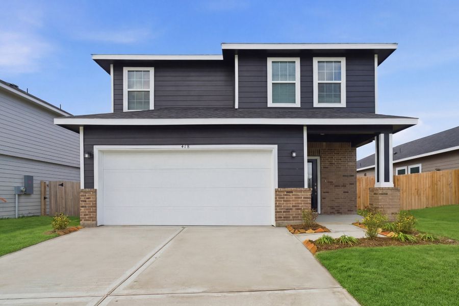 Front exterior of a new home in The Reserve at Huntsville, Huntsville, TX, highlighting curb appeal (Image 1). Front exterior of a new home in The Reserve at Huntsville, Huntsville, TX, highlighting curb appeal (Image 1).