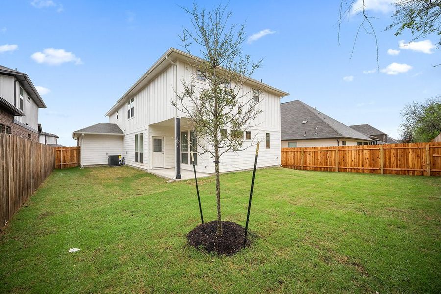 Front exterior of a new home in The Hills of Bear Creek, Manchaca, TX, highlighting curb appeal (Image 38).