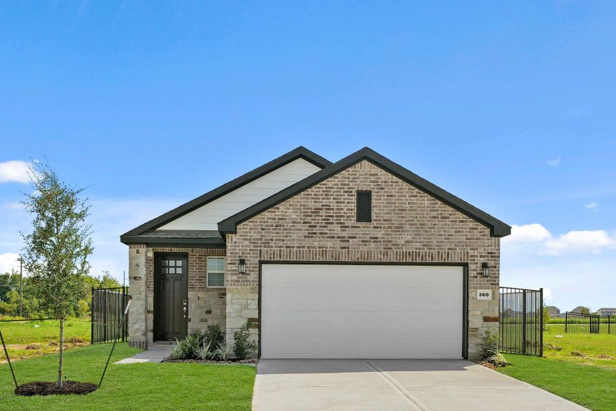 Front exterior of a new home in River Ranch Trails, Dayton, TX, highlighting curb appeal (Image 17).