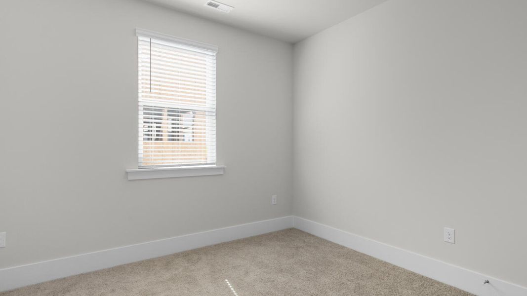 Spacious, unfurnished interior of a new home in Surfside Landing, Hubert (Image 18).