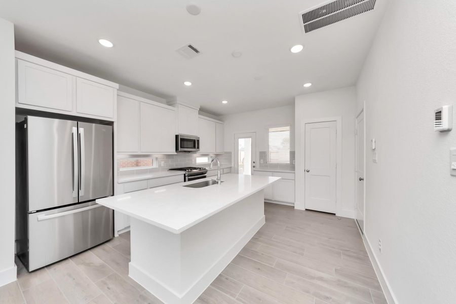 Furnished interior view inside a new home in Sienna, Missouri City (Image 5).