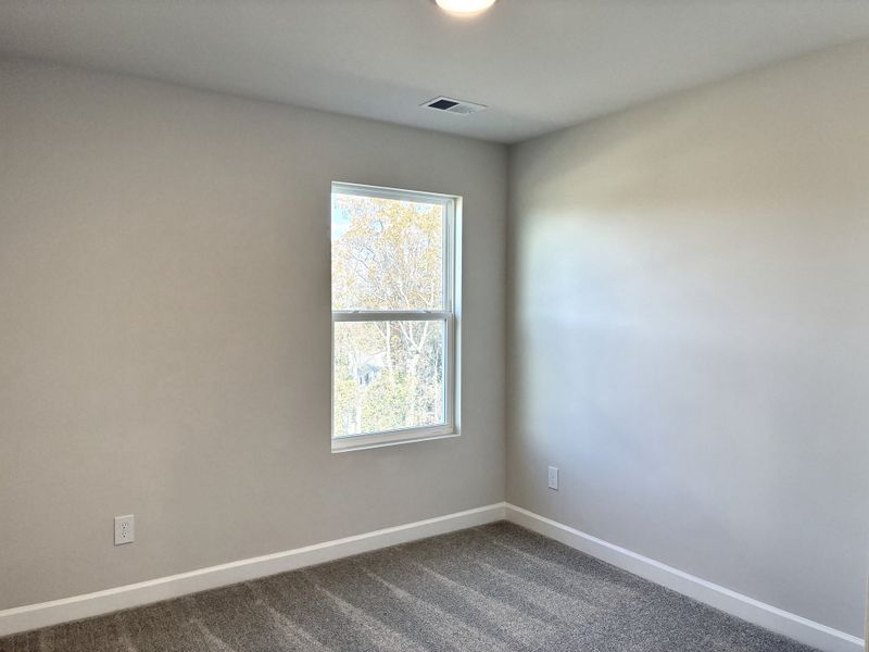 Spacious, unfurnished interior of a new home in Holly View, Greenville (Image 18).