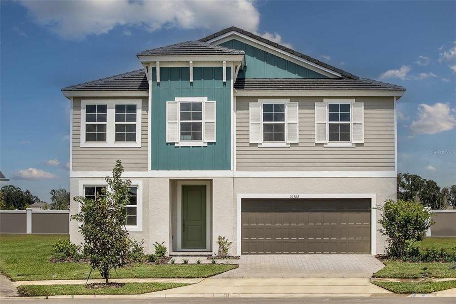Front exterior of a new home in Hawkstone, Riverview, FL, highlighting curb appeal (Image 1).
