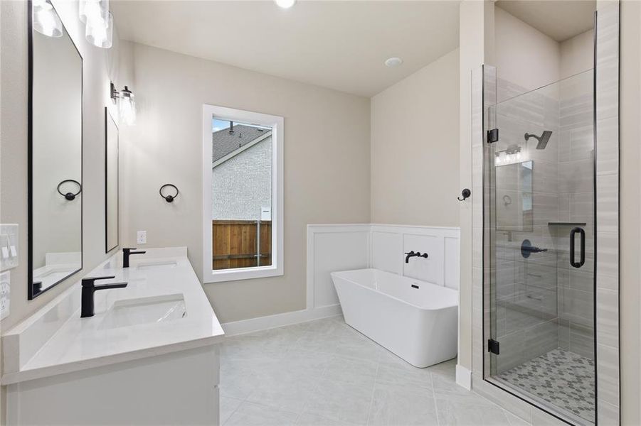 Modern bathroom featuring a dual vanity with rectangular sinks, quartz countertops, and matte black fixtures Modern bathroom featuring a dual vanity with rectangular sinks, quartz countertops, and matte black fixtures