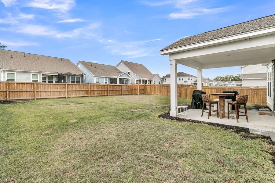 Exterior details and patio area of a home in High Point at Foxbank, Moncks Corner (Image 32).