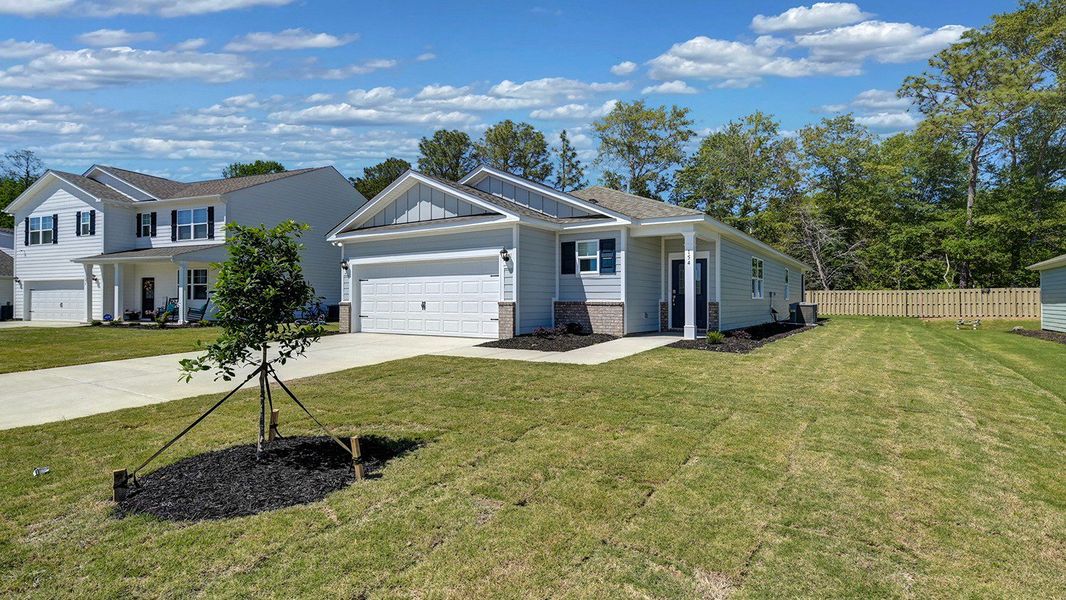 Front exterior of a new home in Sease's Pond, Gilbert, SC, highlighting curb appeal (Image 19).