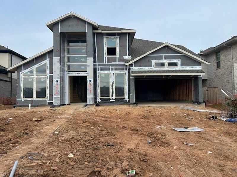 Langford plan by Newmark is a 4 bedroom home with 4.5 baths and a tandem 3-car garage.