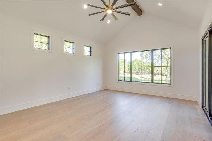 Empty room featuring a ceiling fan, light wood-style floors, and recessed lighting