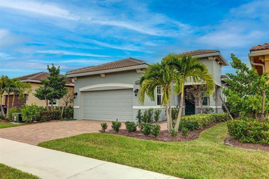 Front exterior of a new home in , Port St. Lucie, FL, highlighting curb appeal (Image 19).