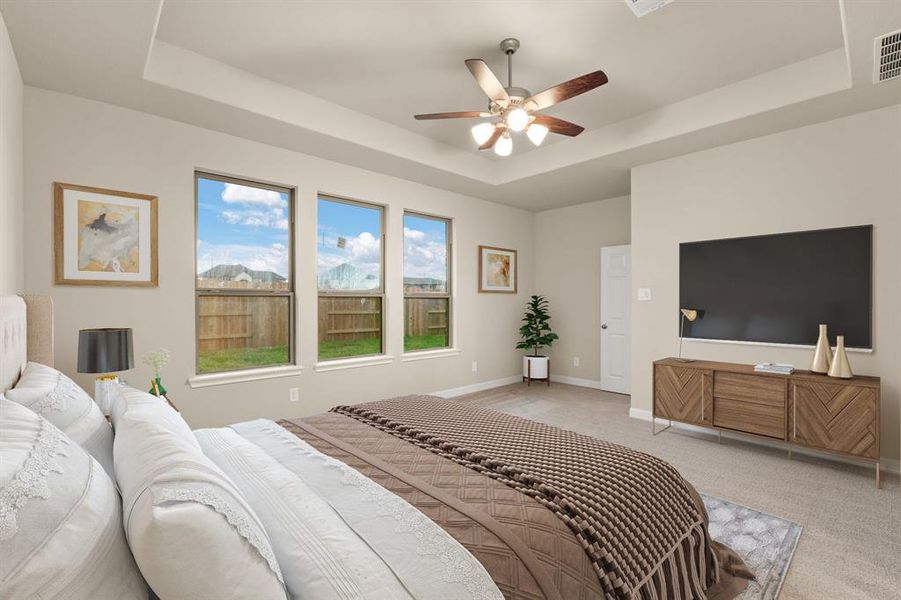 The primary bedroom is generously sized, creating a tranquil and spacious retreat that offers ample room for relaxation. Featuring plush carpet, high ceilings, fresh paint, and large windows that lets in natural lighting throughout the day.