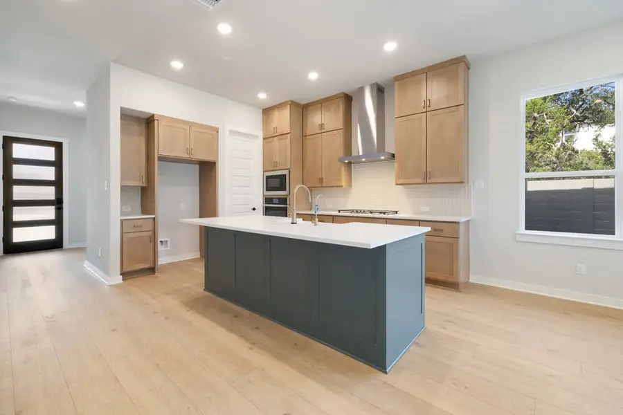 Furnished interior view inside a new home in Arbor Collection At Wolf Ranch, Georgetown (Image 9).