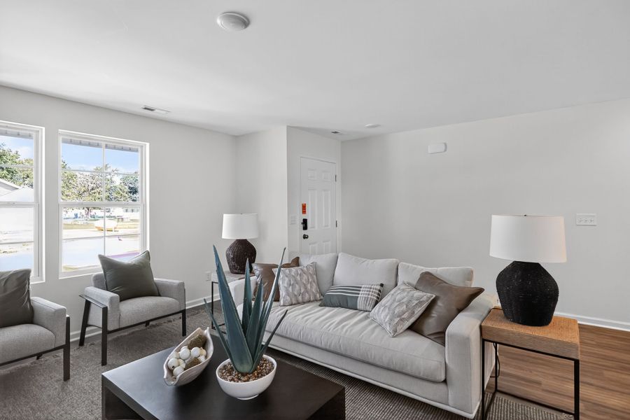 A living room with a couch and a coffee table.