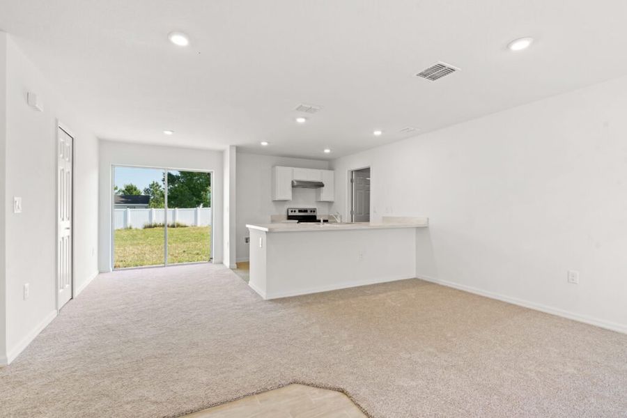 Representative unfurnished interior of a home built from the Phoenix by Holiday Builders in Poinciana, Poinciana (Image 9). Representative unfurnished interior of a home built from the Phoenix by Holiday Builders in Poinciana, Poinciana (Image 9).