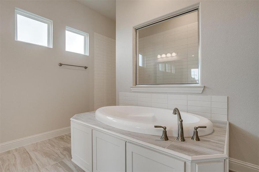 Bathroom featuring a washtub