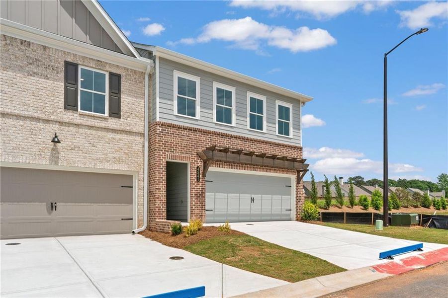 Front exterior of a new home in Wilkins Walk, Mableton, GA, highlighting curb appeal (Image 18).