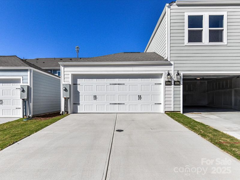 Exterior details and patio area of a home in North Creek Village - Townhomes, Huntersville (Image 23).