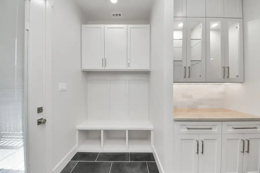 Mud Room off of the back patio. Also has a butler pantry/ coffee bar area Mud Room off of the back patio. Also has a butler pantry/ coffee bar area