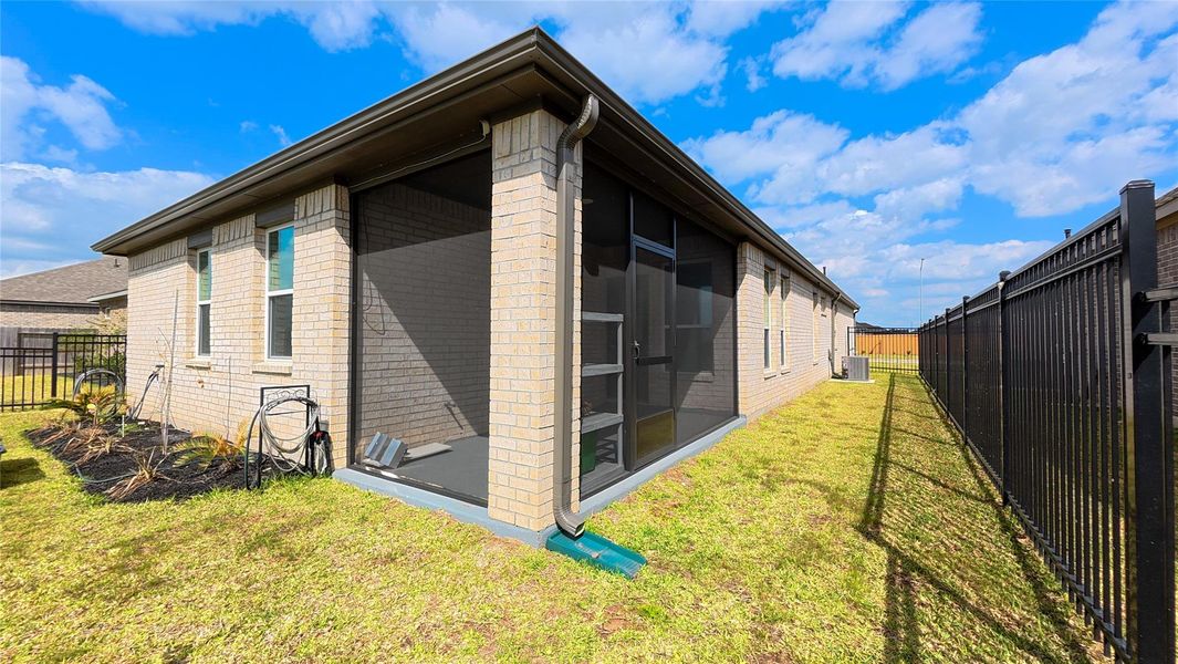 Exterior details and patio area of a home in Sunterra, Katy (Image 15).