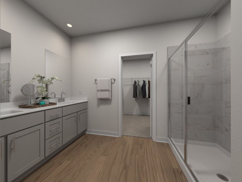 The primary bathroom offers dual vanity sinks a walk-in shower.