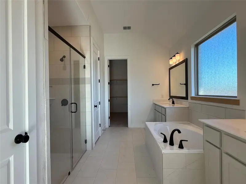 Primary Bath retreat with dual vanities & garden tub Primary Bath retreat with dual vanities & garden tub