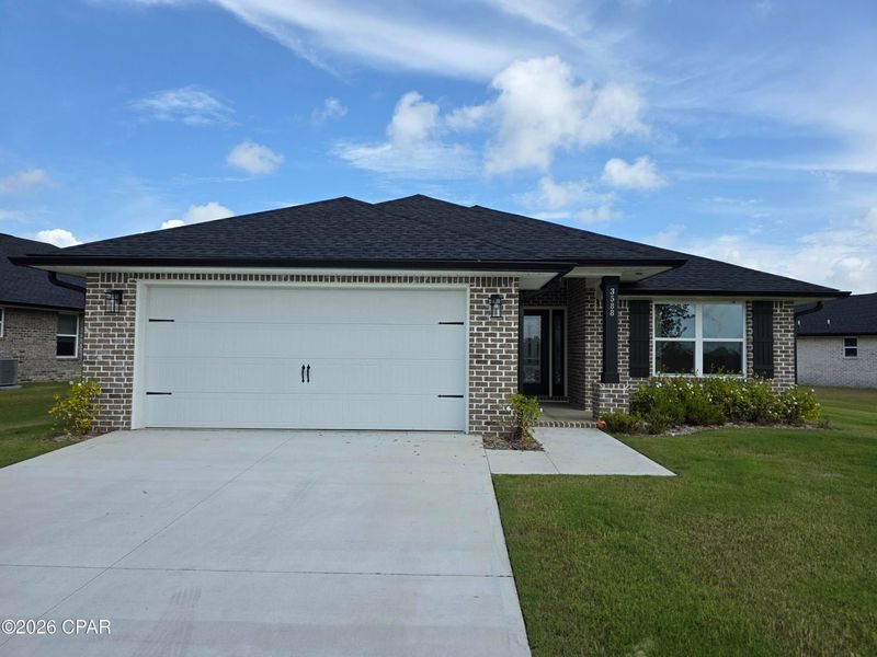 Front exterior of a new home in College Station, Panama City, FL, highlighting curb appeal (Image 1). Front exterior of a new home in College Station, Panama City, FL, highlighting curb appeal (Image 1).