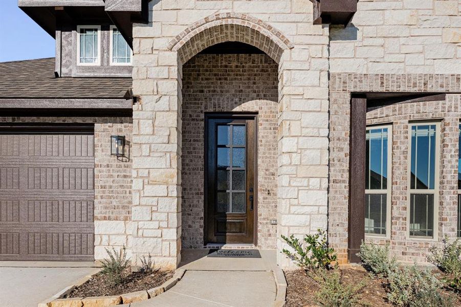 Exterior details and patio area of a home in Coyote Crossing, Godley (Image 27).