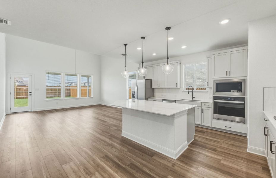 Representative furnished interior of a home built from the Woodland by Pulte Homes in Santa Rita Ranch, Liberty Hill (Image 9).