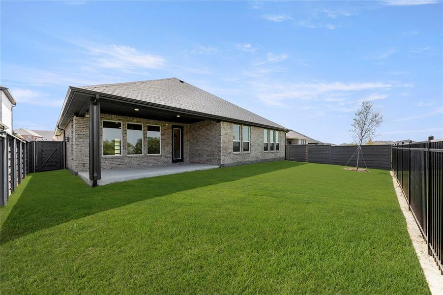 Exterior details and patio area of a home in Inspiration Collection at Union Park, Little Elm (Image 18).