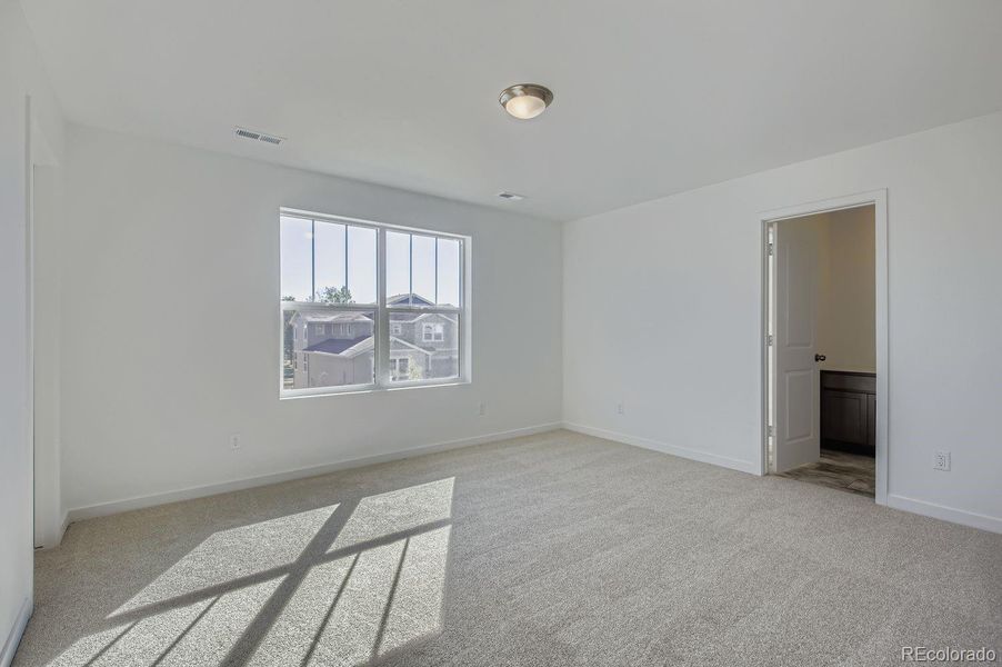 Spacious, unfurnished interior of a new home in Riano Ridge: The Monarch Collection, Loveland (Image 12).