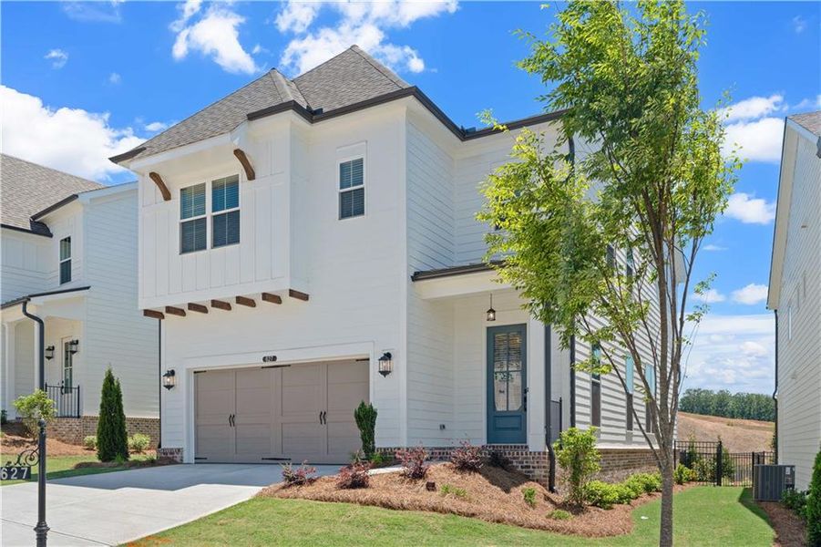 Front exterior of a new home in Palisades Single Family, Cumming, GA, highlighting curb appeal (Image 23).