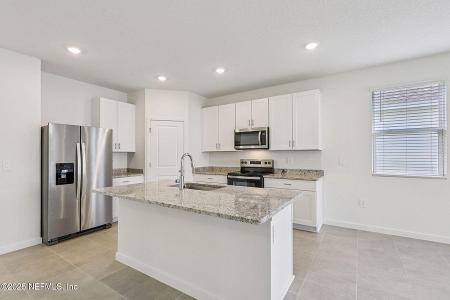 Furnished interior view inside a new home in Lakes at Bella Lago - Signature Series, Green Cove Springs (Image 13). Furnished interior view inside a new home in Lakes at Bella Lago - Signature Series, Green Cove Springs (Image 13).