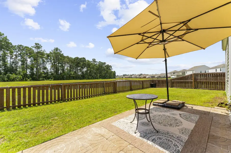 Exterior details and patio area of a home in Pine Hills at Cane Bay, Summerville (Image 26).