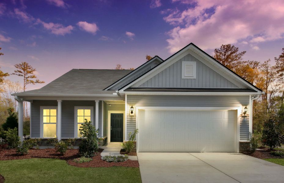 Front exterior of a new home in Crescent Cove, Myrtle Beach, SC, highlighting curb appeal (Image 18). Front exterior of a new home in Crescent Cove, Myrtle Beach, SC, highlighting curb appeal (Image 18).