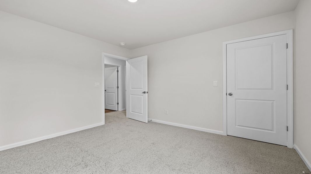 Spacious, unfurnished interior of a new home in Village Grove, Greenville (Image 25).