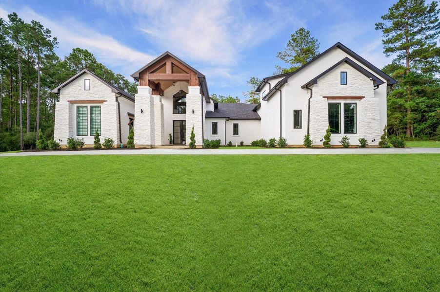 Thoughtfully designed to blend luxury living with the natural beauty of its wooded surroundings.