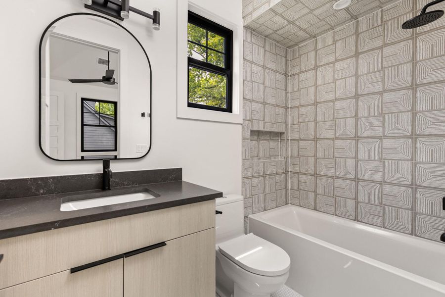Bathroom featuring vanity and shower / washtub combination Bathroom featuring vanity and shower / washtub combination