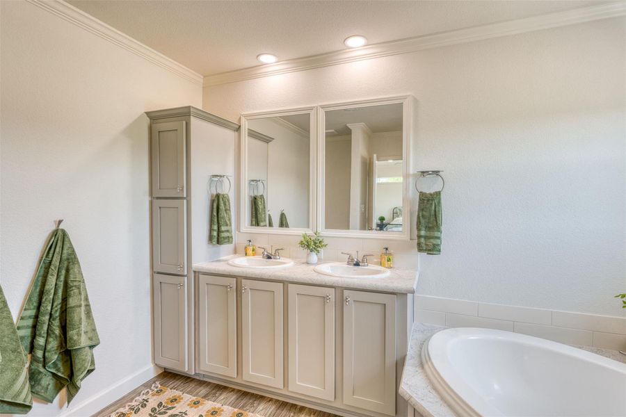 Double vanity and a soaking tub create a luxurious bathing experience. Double vanity and a soaking tub create a luxurious bathing experience.