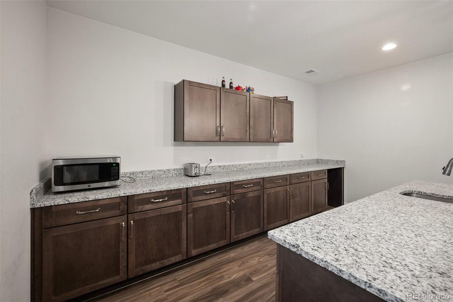 Basement bar area for tons of storage and potential future kitchen.