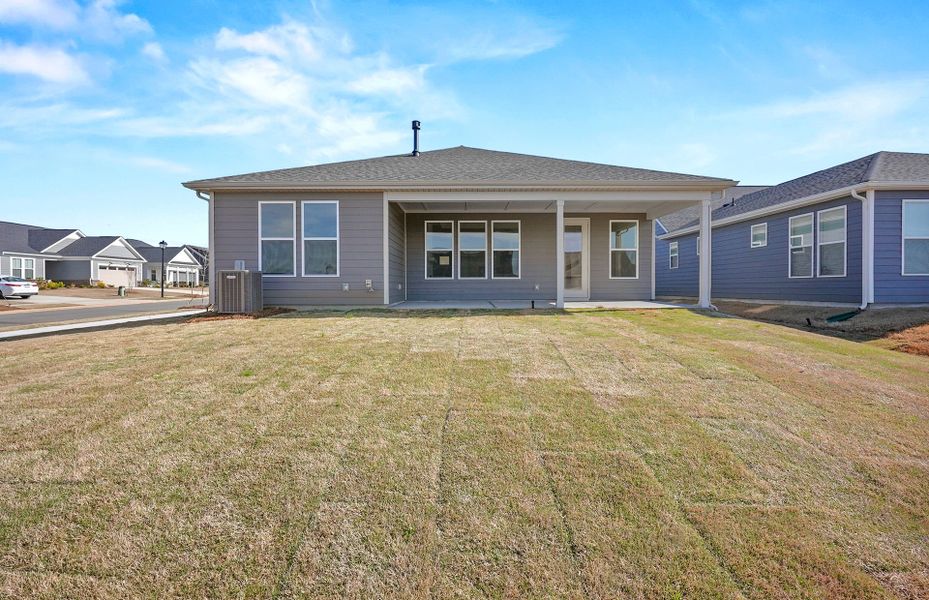 Exterior details and patio area of a home in Carolina Riverside, Belmont (Image 28).