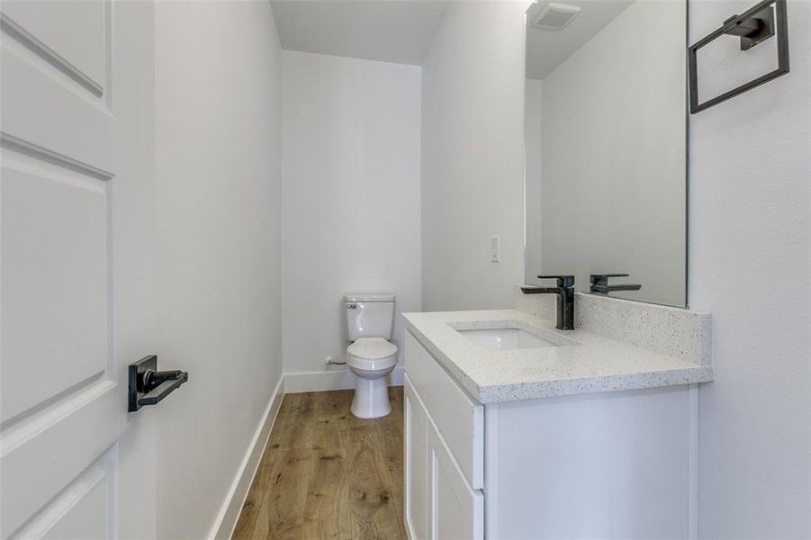 downstairs half bath off of dining area
