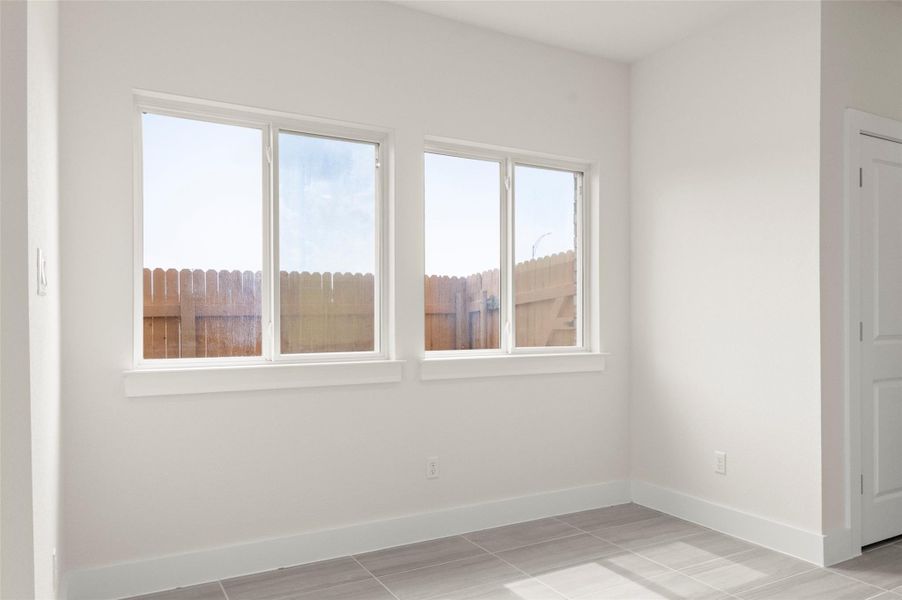 Unfurnished room with baseboards
