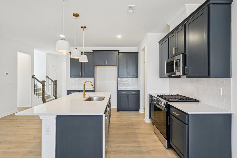 Kitchen featuring the AW Collection® Sapphire - Vibrant blues and crisp whites steal the show.