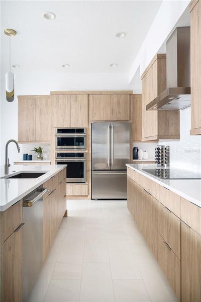 Kitchen of previously built Veranda Model home. Note: color selections and cabinet style may vary in this preconstruction home.