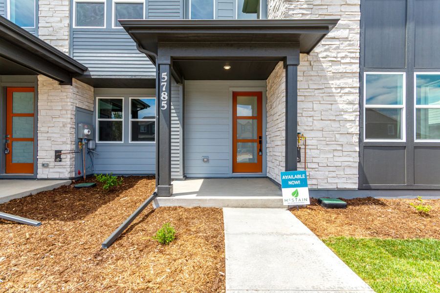 Front exterior of a new home in Painted Prairie, Aurora, CO, highlighting curb appeal (Image 16).
