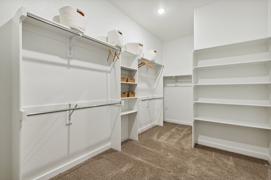 Primary Closet in the Gilmour home plan by Trophy Signature Homes – REPRESENTATIVE PHOTO Primary Closet in the Gilmour home plan by Trophy Signature Homes – REPRESENTATIVE PHOTO