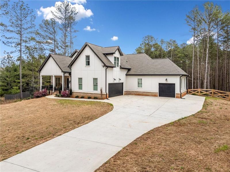 Front exterior of a new home in , Bethlehem, GA, highlighting curb appeal (Image 22).