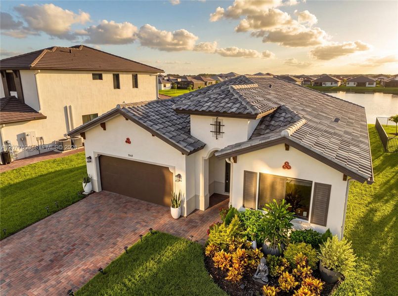 Front exterior of a new home in , Immokalee, FL, highlighting curb appeal (Image 32).